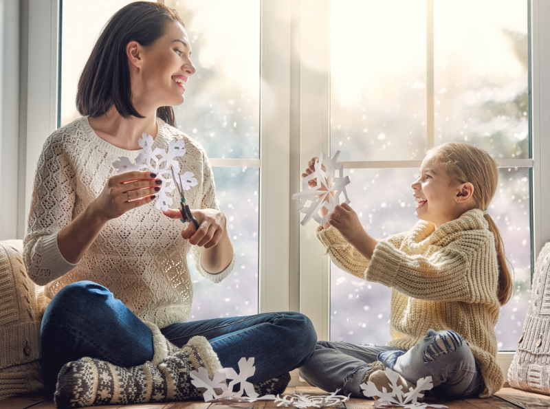 Mother and daughter making winter crafts