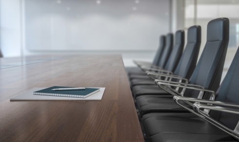 A boardroom with chairs